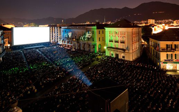Open-air cinema in Locarno in the evening with thousands of visitors