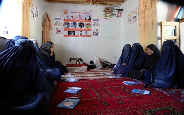 Young women attending the literacy and tailoring course