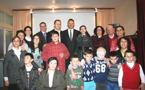Students and staff at the Institute for Blind Students in Tirana, Albania, with Swiss Ambassador Christoph Graf