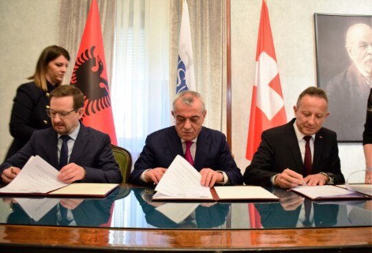 OSCE Secretary General Thomas Greminger with Albania's Speaker of Parliament Gramoz Ruçi and Swiss Ambassador Christoph Graf signing agreement for new support project.