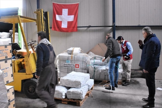 Swiss humanitarian mission delivering supplies in Lezhë, Albania.