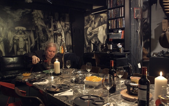 Giger drinks wine