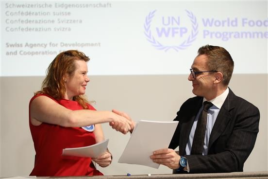 H.E. Ambassador Lukas Rosenkranz and WFP Officer in Charge Nanna Skau sign the REBCA contract