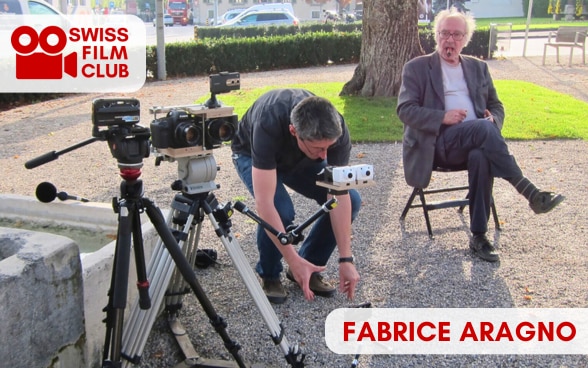 Fabrice Aragno (left) and Jean-Luc Godard (right) on set for "Goodbye to Language" (2014).