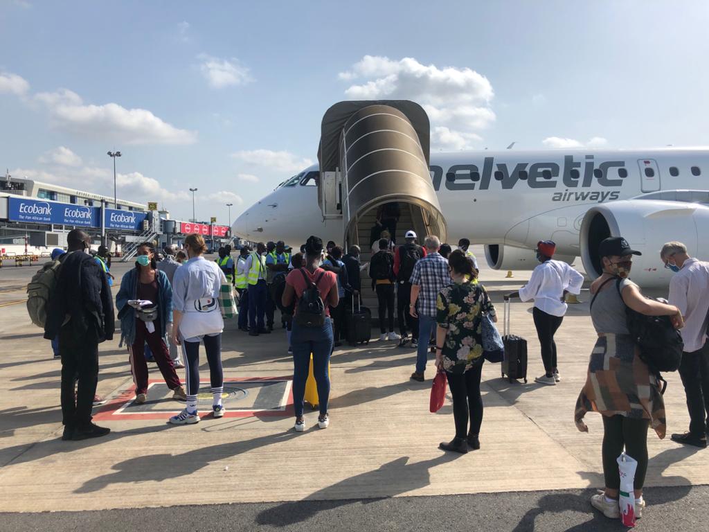 Swiss returnees board flight