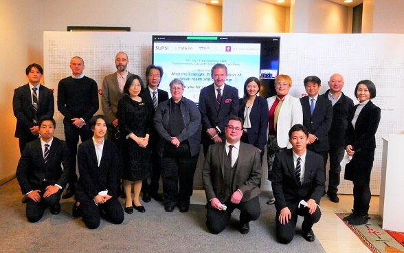 Ambassador Andreas Baum (back row, center) surrounded by speakers and organizers