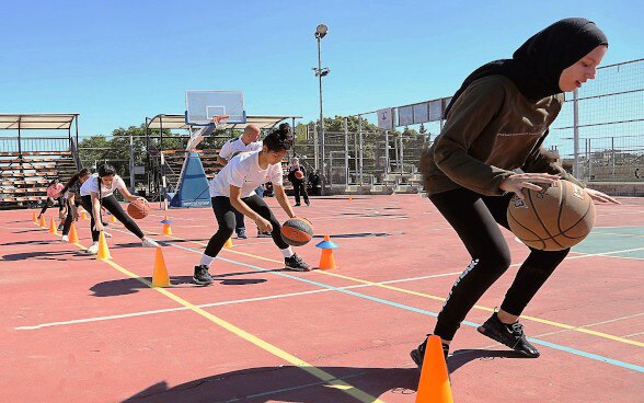 Girls from vulnerable families receiving sports training in the Old City of Jerusalem, safeguard children’s rights project implemented by UNICEF.