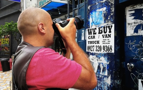 David Giger taking photos in Brgy. Poblacion, Makati