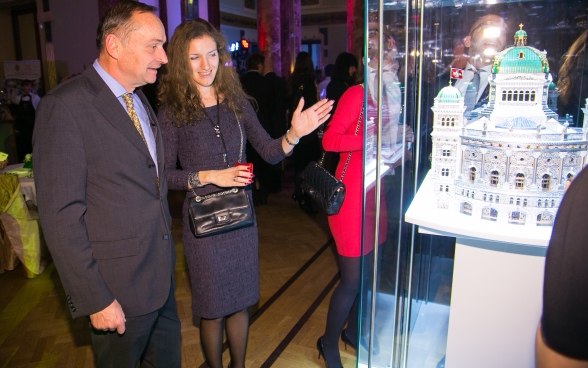 Pierre Helg admires the model of the Swiss parliament building