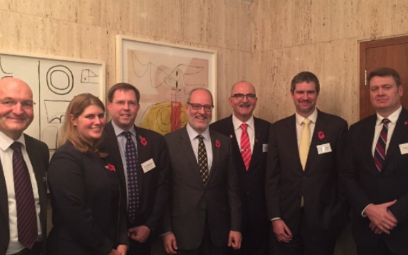 Group photo of the panelists with the Ambassador