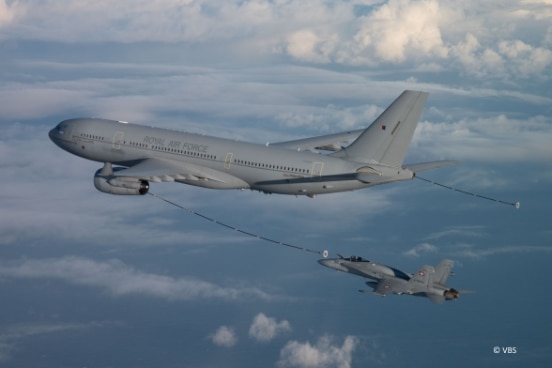A tanker aircraft refueling a jet in mid-air