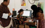 Woman working at a computer.