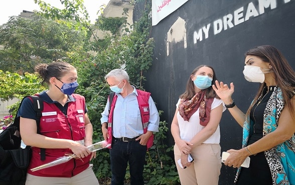 Emilie Schmid talks with a group of people during the opening of the temporary paediatric ward built by Switzerland in Beirut.