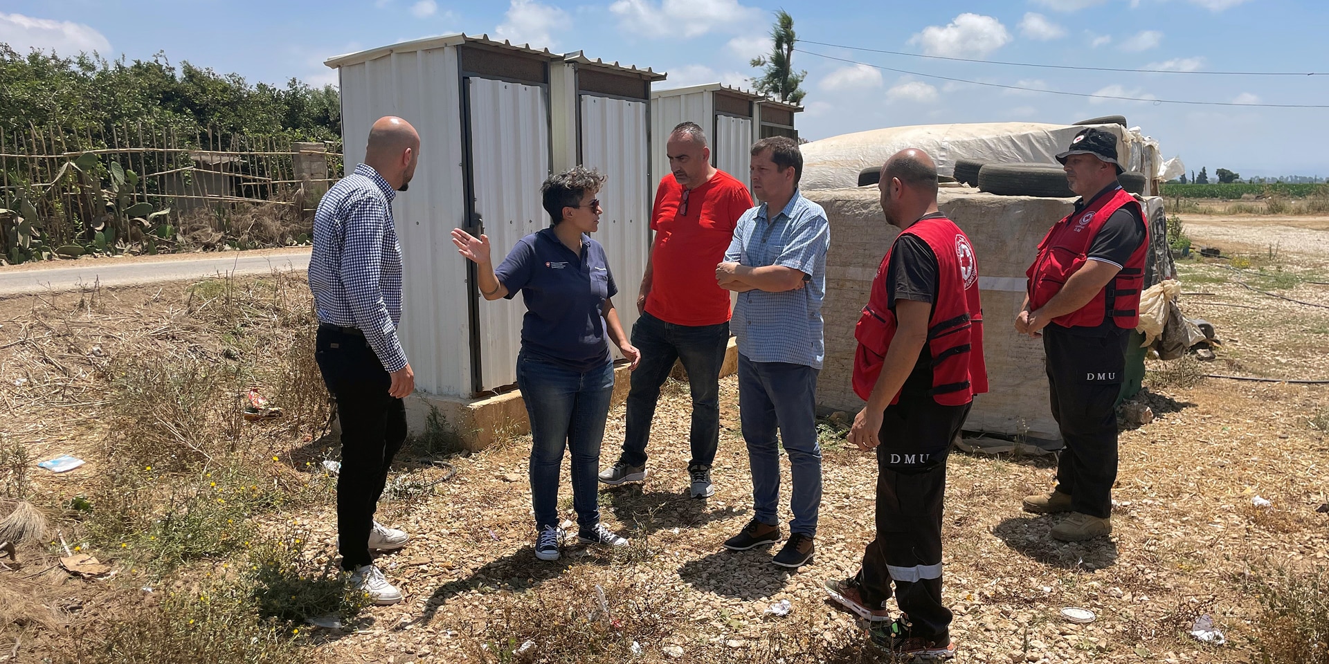 The picture shows Michelle Jalkh on a field visit in Akkar, Lebanon, together with representatives of the Lebanese Red Cross and a Swiss Humanitarian Aid Unit expert.