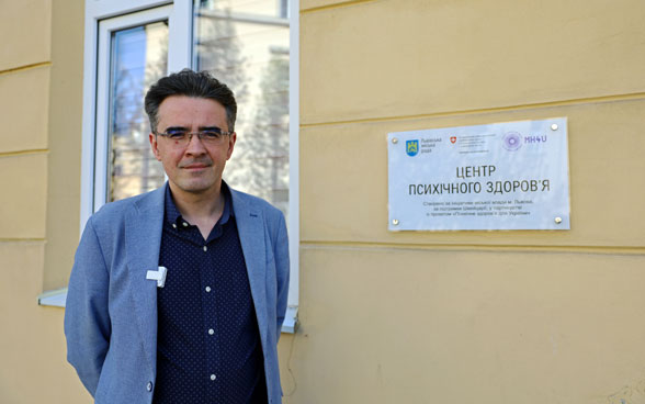 Orest Suvalo, Psychiatrist and Project Manager of the Mental Health for Ukraine project, standing in front of the Mental Health Centre.