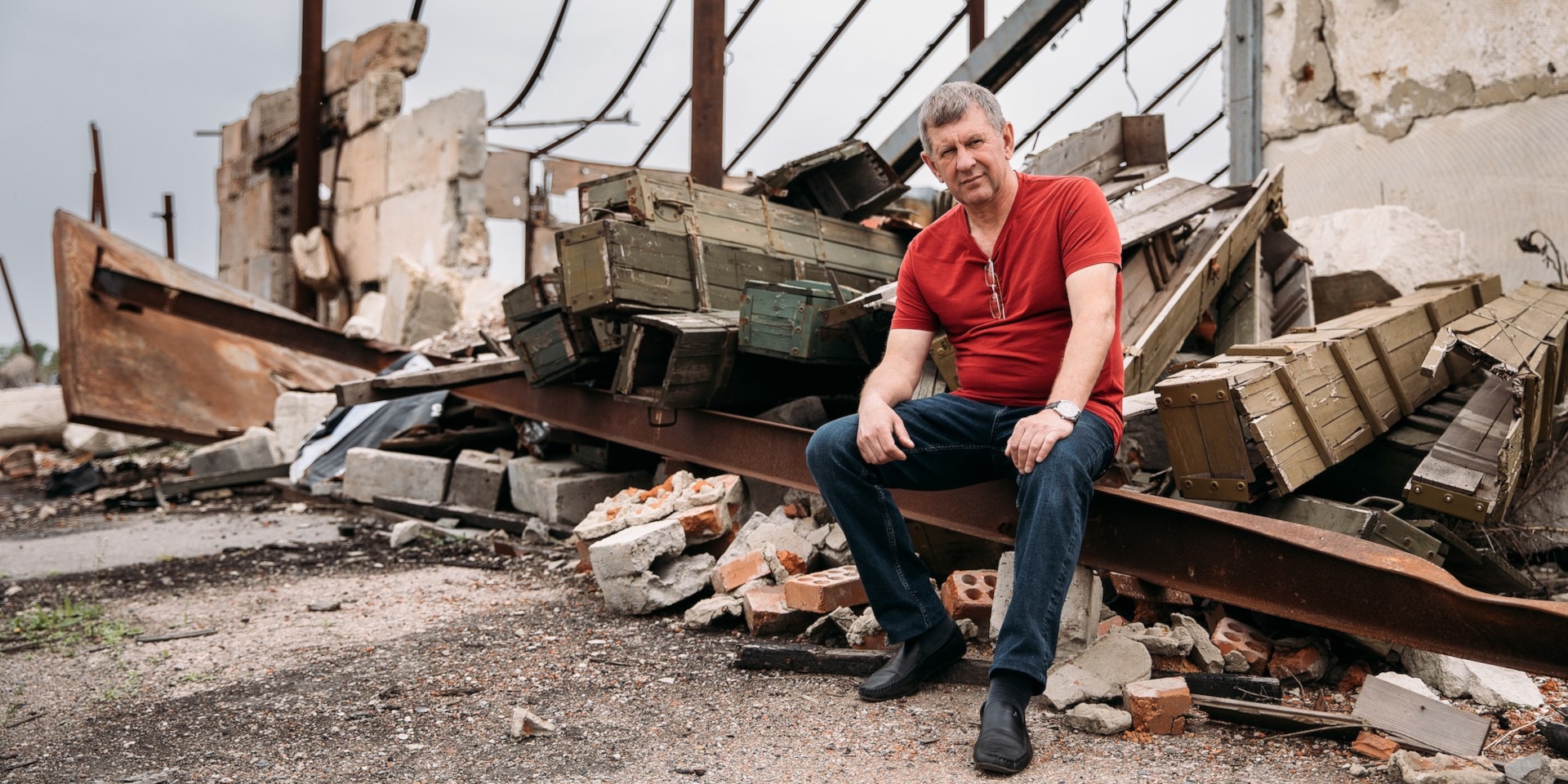 Valerii poses in front of his farm in Kharkiv oblast.