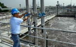 A man working in a wastewater treatment plant