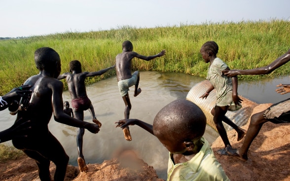 Sudanese children jumping in water
