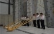 Six Swiss musicians in traditional attire give an alphorn concert in the new climbing gym in the town of Sátoraljaújhely.