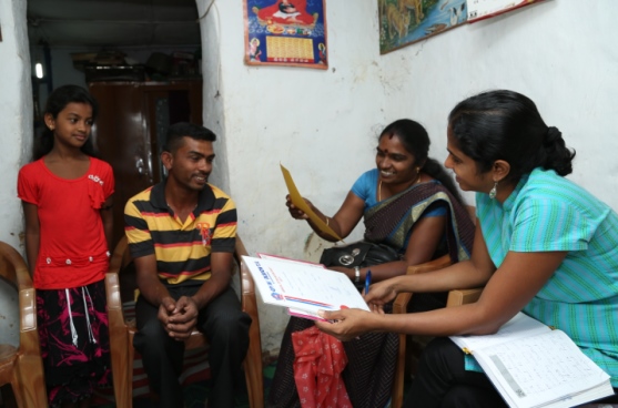 Family members excitedly examine their travel documents