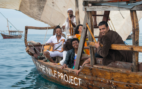 Nile Project musicians on a boat.