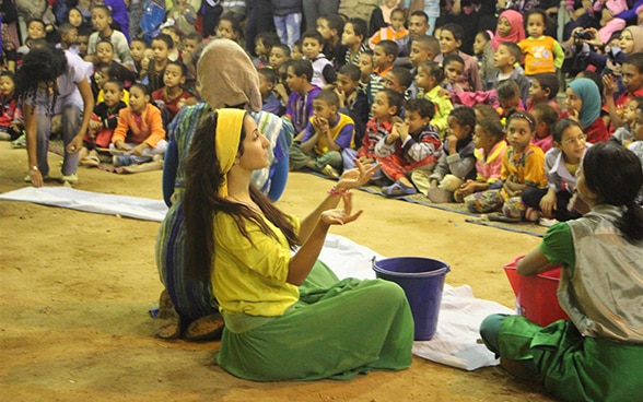 A woman performs in a play for schoolchildren about water, in the Egyptian city of Aswan.