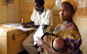 Woman during a medical consultation with her baby in Gambia