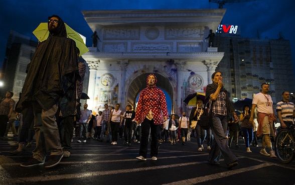 People march through the centre of Skopje.