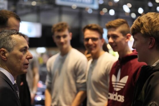 Federal Councillor Ignazio Cassis talks to young people at the 89th International Motor Show in Geneva on March 7, 2019.