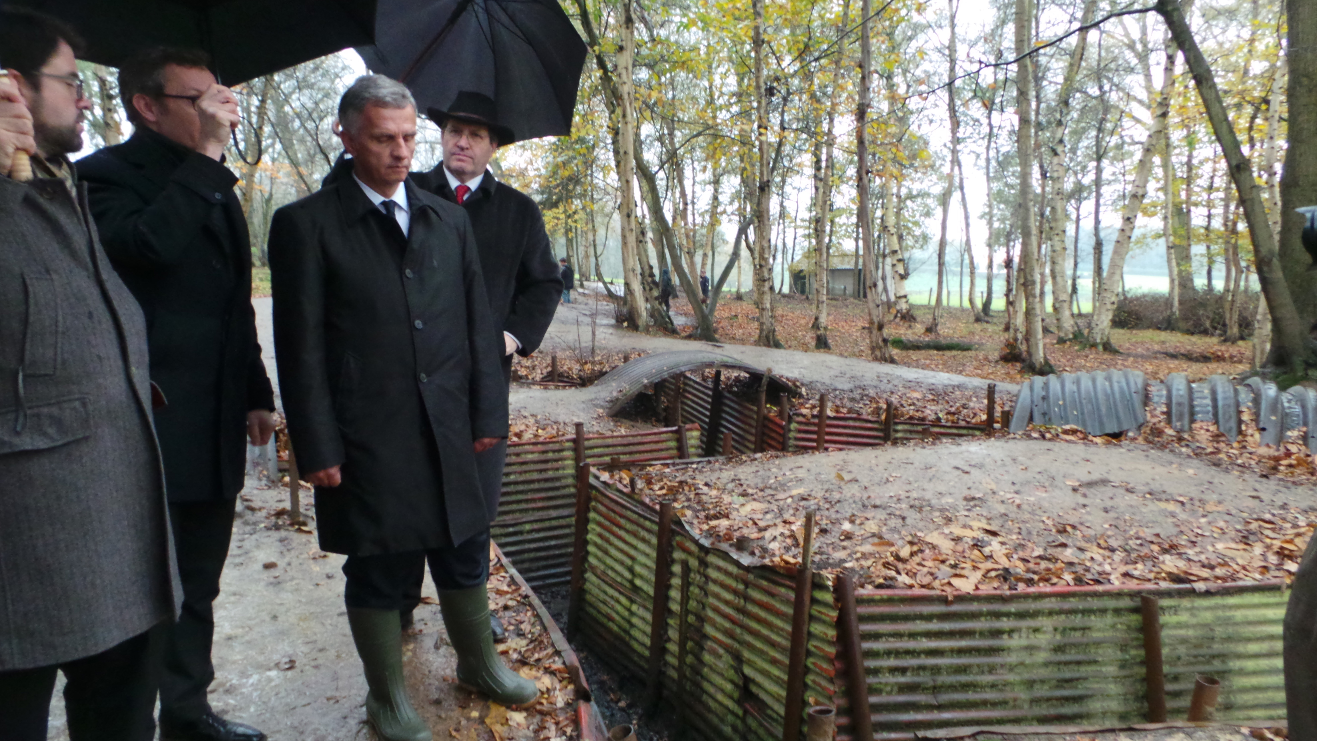 The President of the Swiss Confederation, Didier Burkhalter, standing next to a section of the "Hill 62" First World War trench near Ypres in Belgium