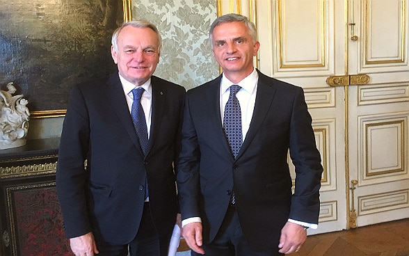 Didier Burkalter and Jean-Marc Ayrault standing