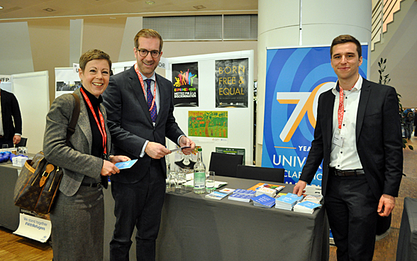 Deputy State Secretary Marty Lang and Cantonal Councillor Cramer visiting the exhibition, accompanied by Nico Bächli, organiser of the event. 