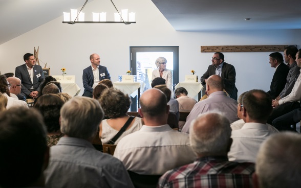 Swiss ambassadors talking to the local population.