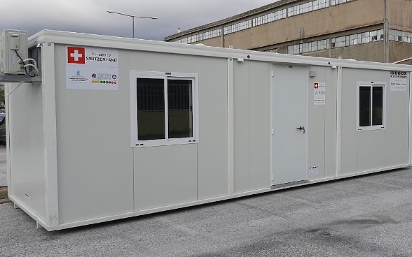 The two mobile containers donated by Switzerland extend over several metres and have one door and two windows each.