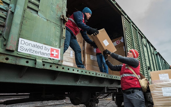 Loading of a train in preparation for a delivery of humanitarian aid from Switzerland.