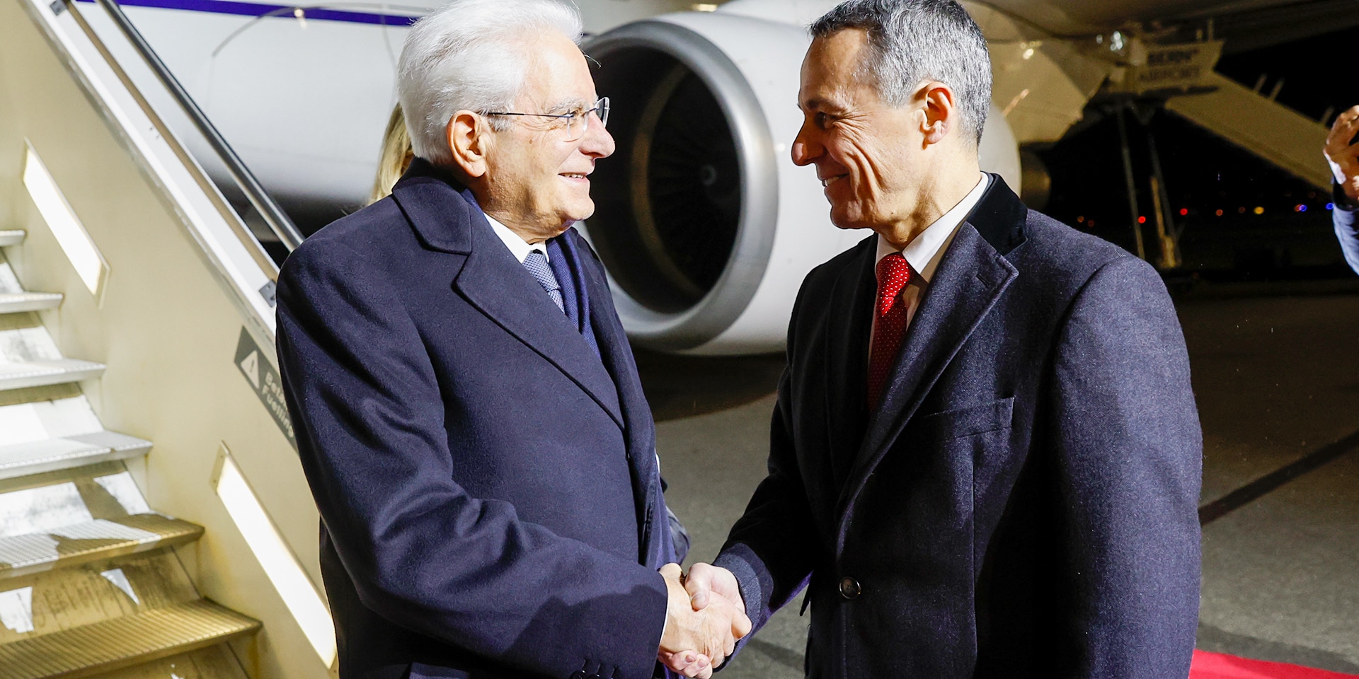 The president of the Swiss Confederation Ignazio Cassis welcomes Italian President Sergio Mattarella at the airport in Belp.