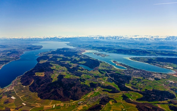 Switzerland is located in the centre of Europe - the picture shows the four-country region of Lake Constance with a panoramic view of the Alps.