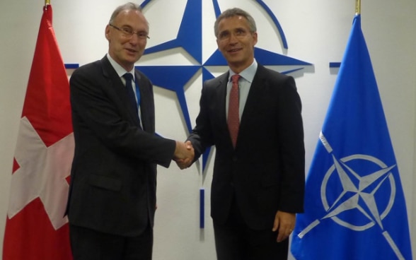 Photo new Head of Mission with NATO SecGen