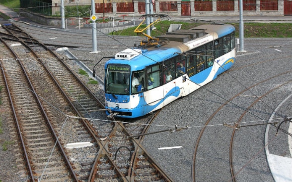 A tram moving along rails.