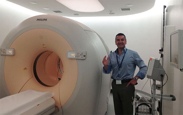 Dr Anthony Samuel, Nuclear medicine specialist,presents a PET scanner. 